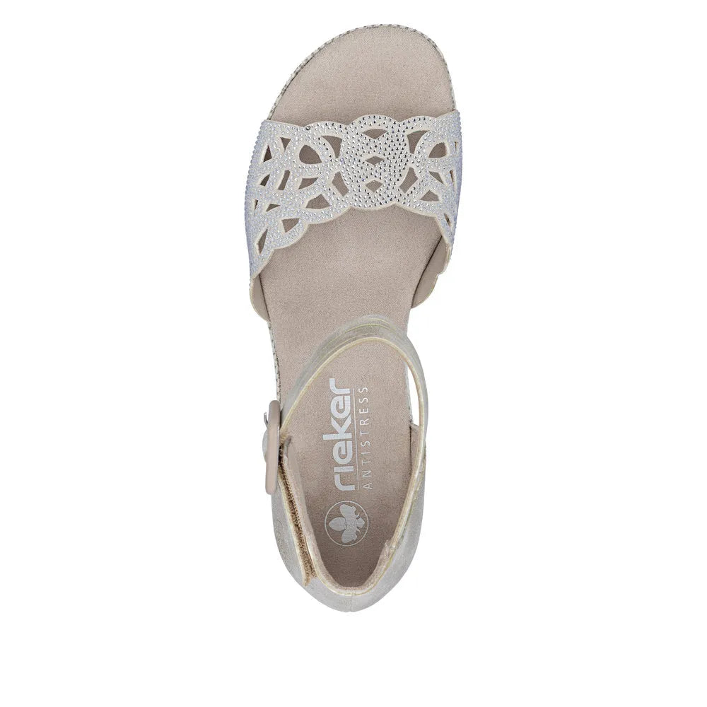 Rieker 69457-60 beige ladies buckle sandals with decorative cutout straps and cushioned footbed.