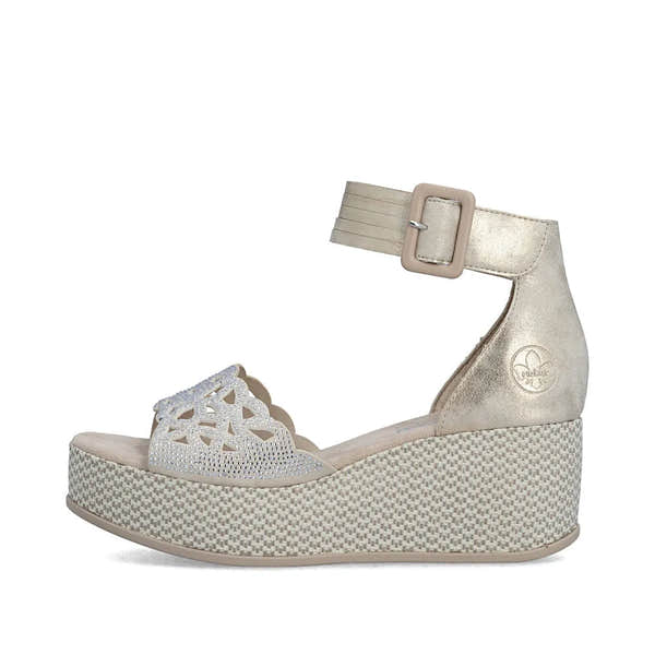 Rieker 69457-60 beige women's wedge sandals with ankle strap, buckle closure, decorative front detail, and textured platform sole.