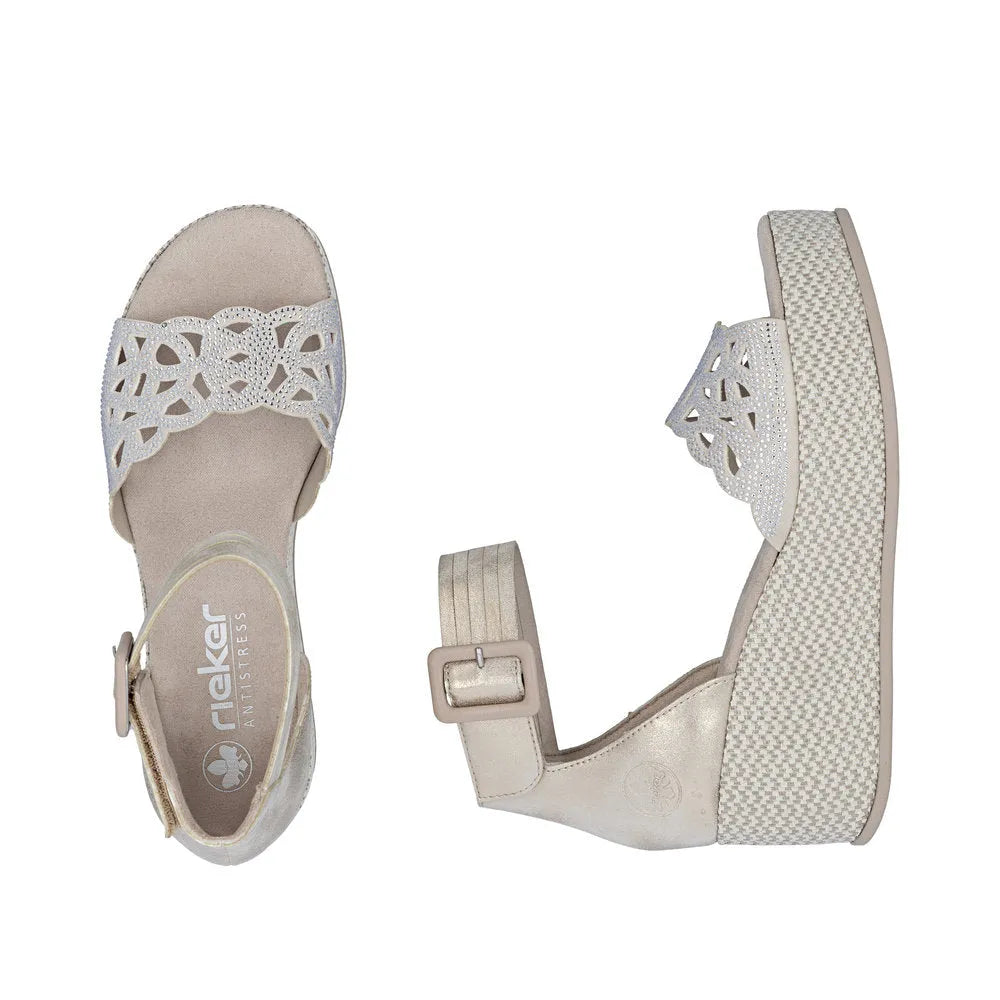 Rieker 69457-60 women's beige buckle sandals with floral cutout design and wedge heel.