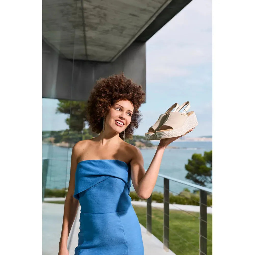 Women’s beige and pale gold slingback platform wedge sandals, stylish and comfortable for summer outings.