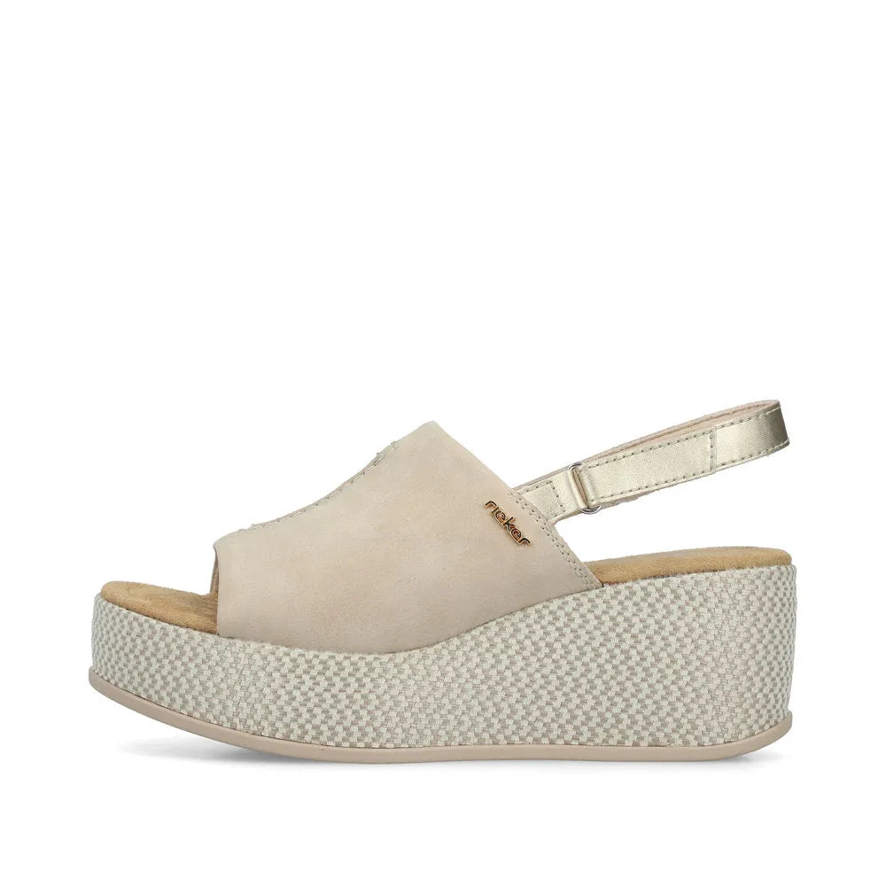 Rieker 69460-62 women's beige and pale gold slingback platform sandals with a textured wedge sole and adjustable strap.