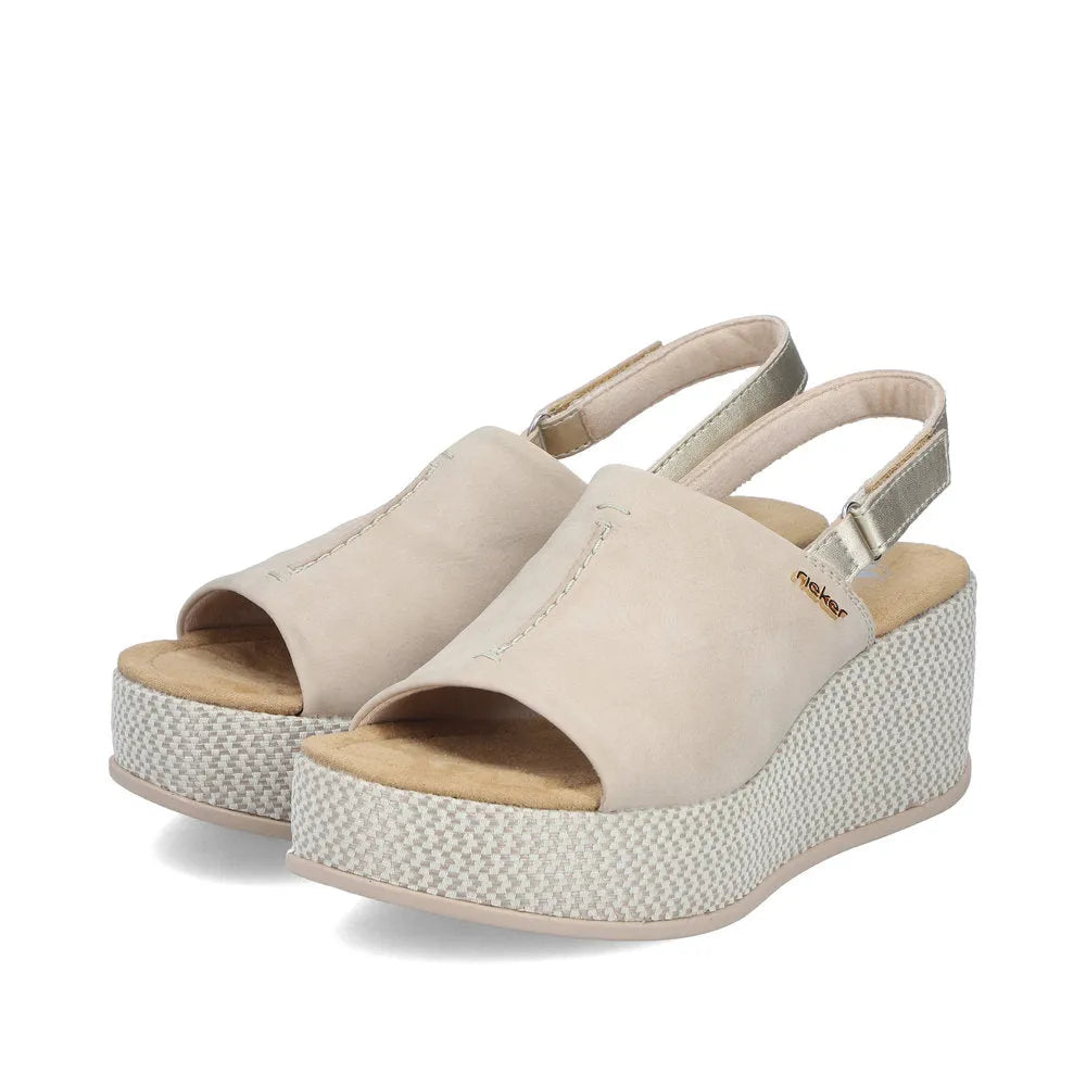 Rieker 69460-62 women's beige and pale gold slingback wedge sandals with pebbled platform and open toe.