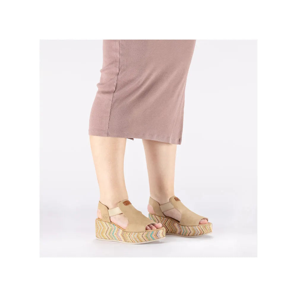 Rieker 69472-60 beige ladies elasticated wedge sandals with colorful woven platform soles.