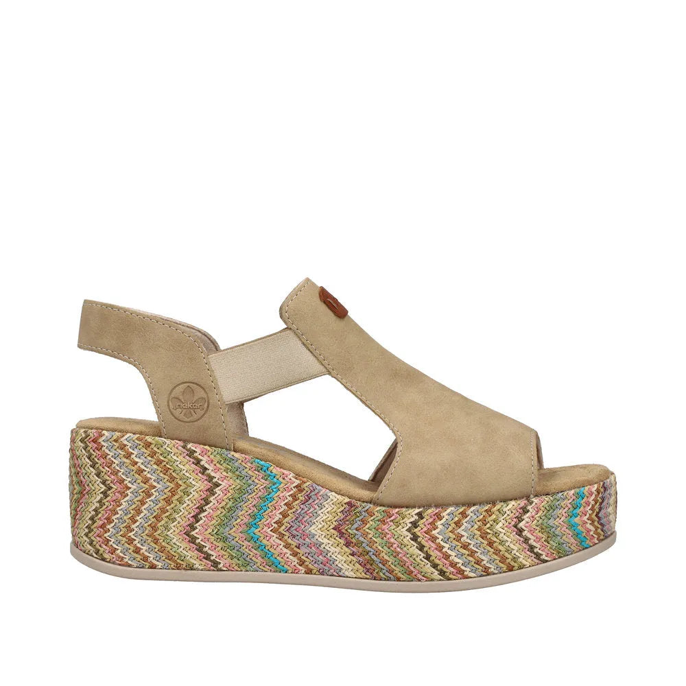 Rieker 69472-60 beige ladies elasticated wedge sandals with a multicolored woven platform outsole.