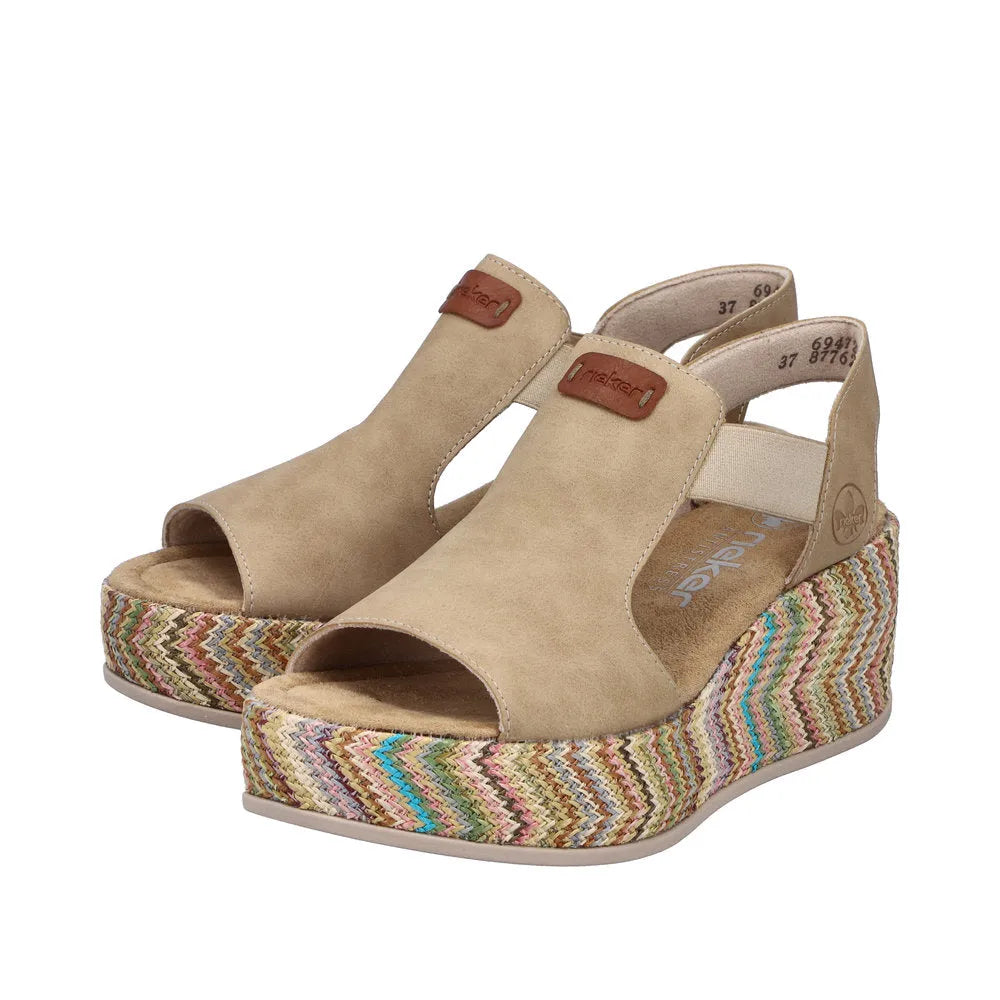 Rieker 69472-60 beige ladies' elasticated ankle-strap platform sandals with colorful woven wedge heel.