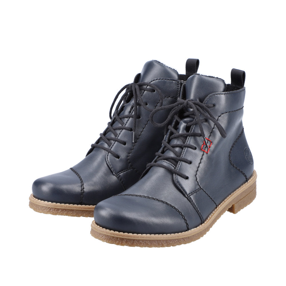 Rieker 73500-14 women's blue ankle boots with lace-up front, side zipper, and chunky beige sole.