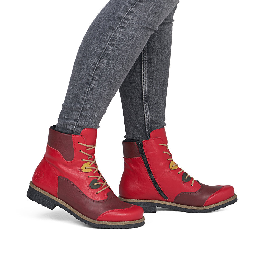 Rieker 73510-33 women's red/brown lace up mid-calf boots, on-foot lifestyle view.