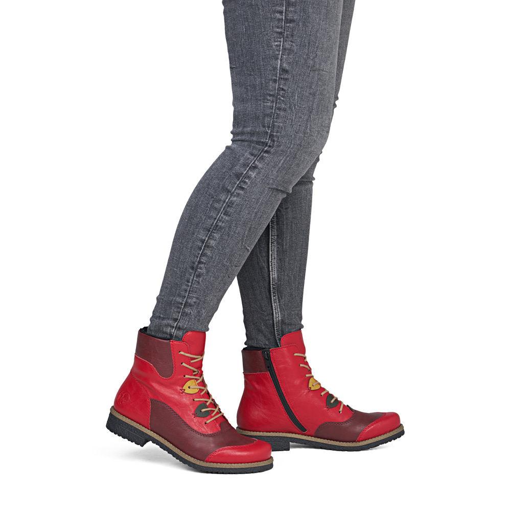 Rieker 73510-33 women's red/brown lace up mid-calf boots, on-foot lifestyle view.