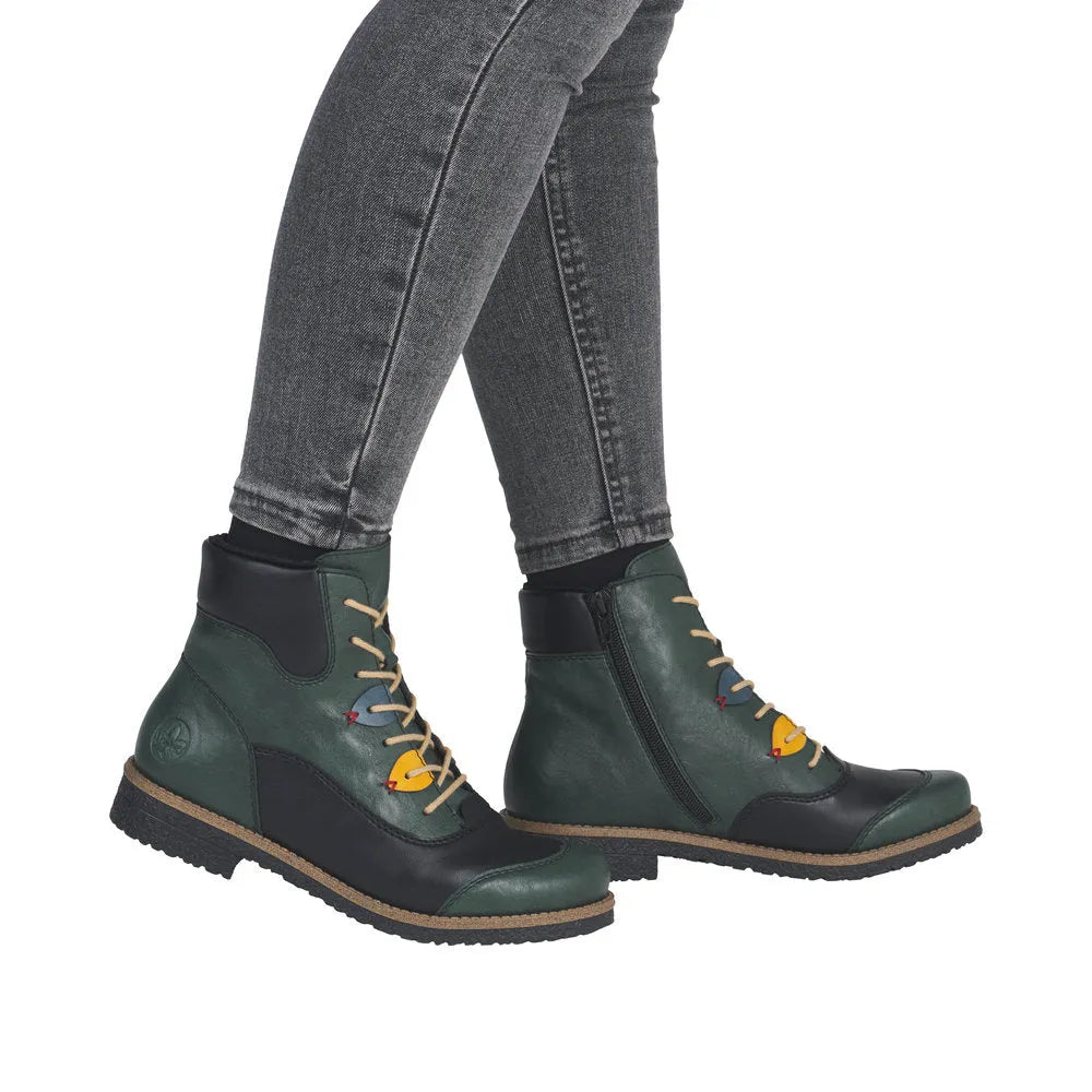 Rieker 73510-90 women's multi-zip lace ankle boots with color accents, black and green leather, and side zipper detail.