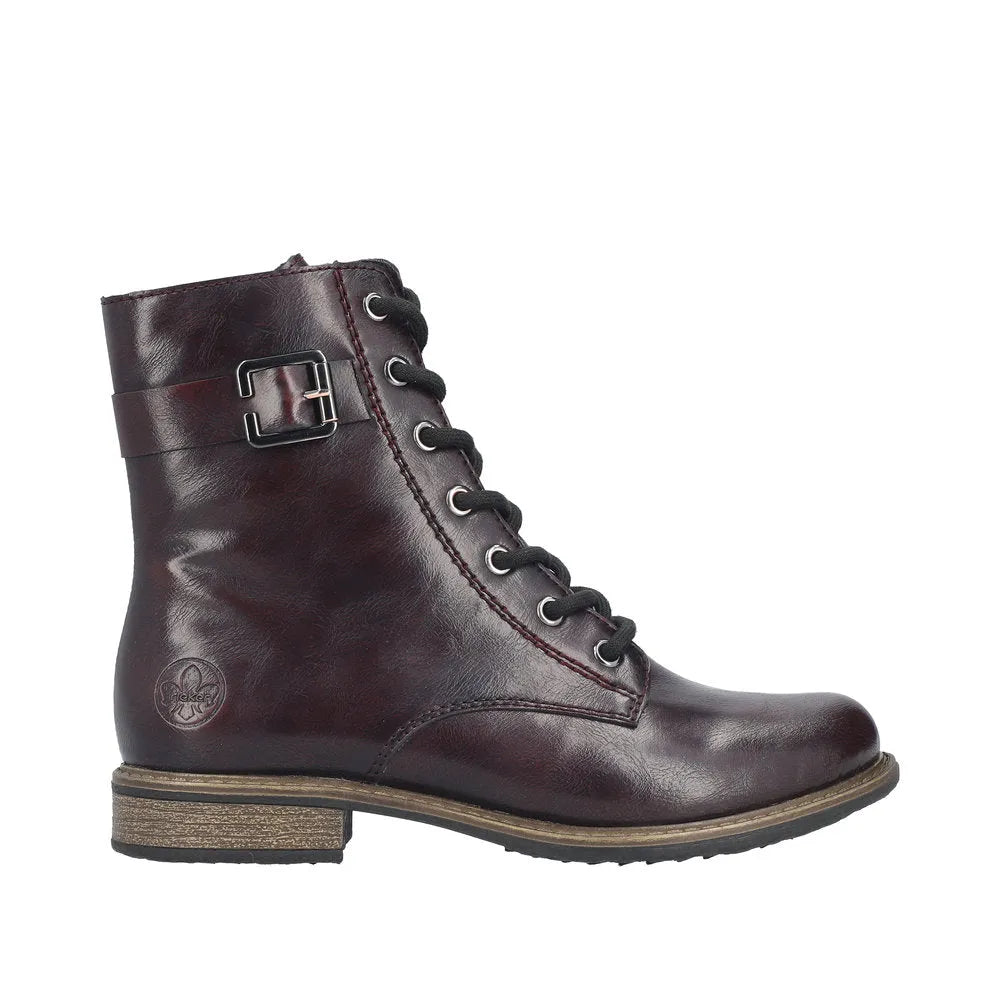 Rieker 74802-35 women's red leather ankle boots with zip, lace-up design, and decorative buckle, featuring a low stacked heel.