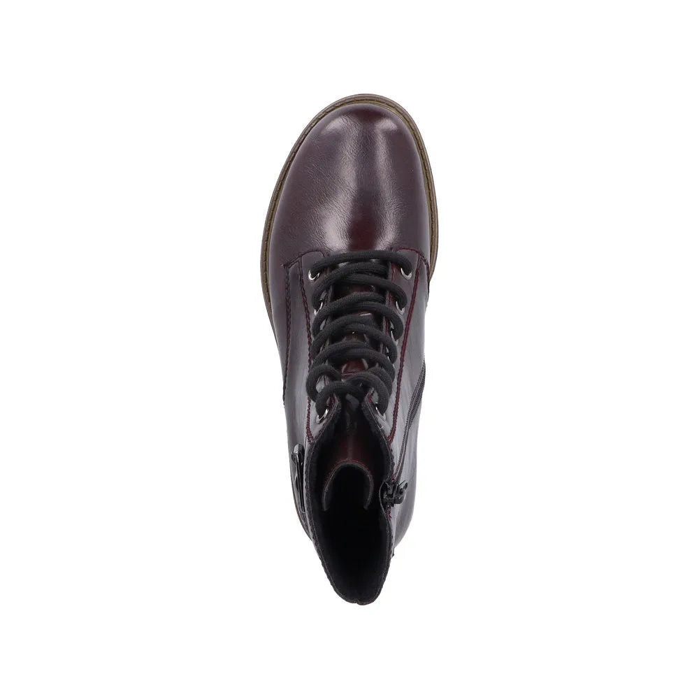 Rieker 74802-35 ladies red ankle boots with lace-up front, zip closure, and stylish comb design.
