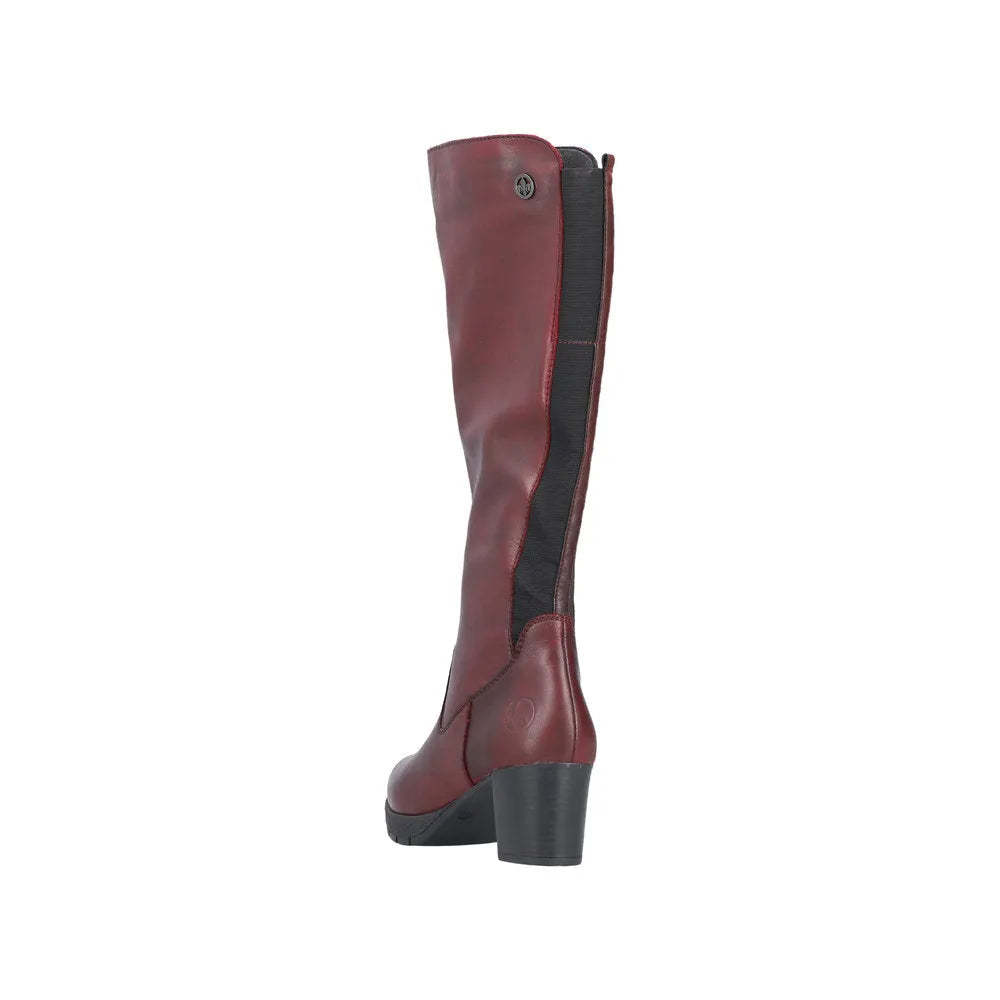 Rieker 77684-35 women's red leather knee-high boots with side zipper and chunky heel.