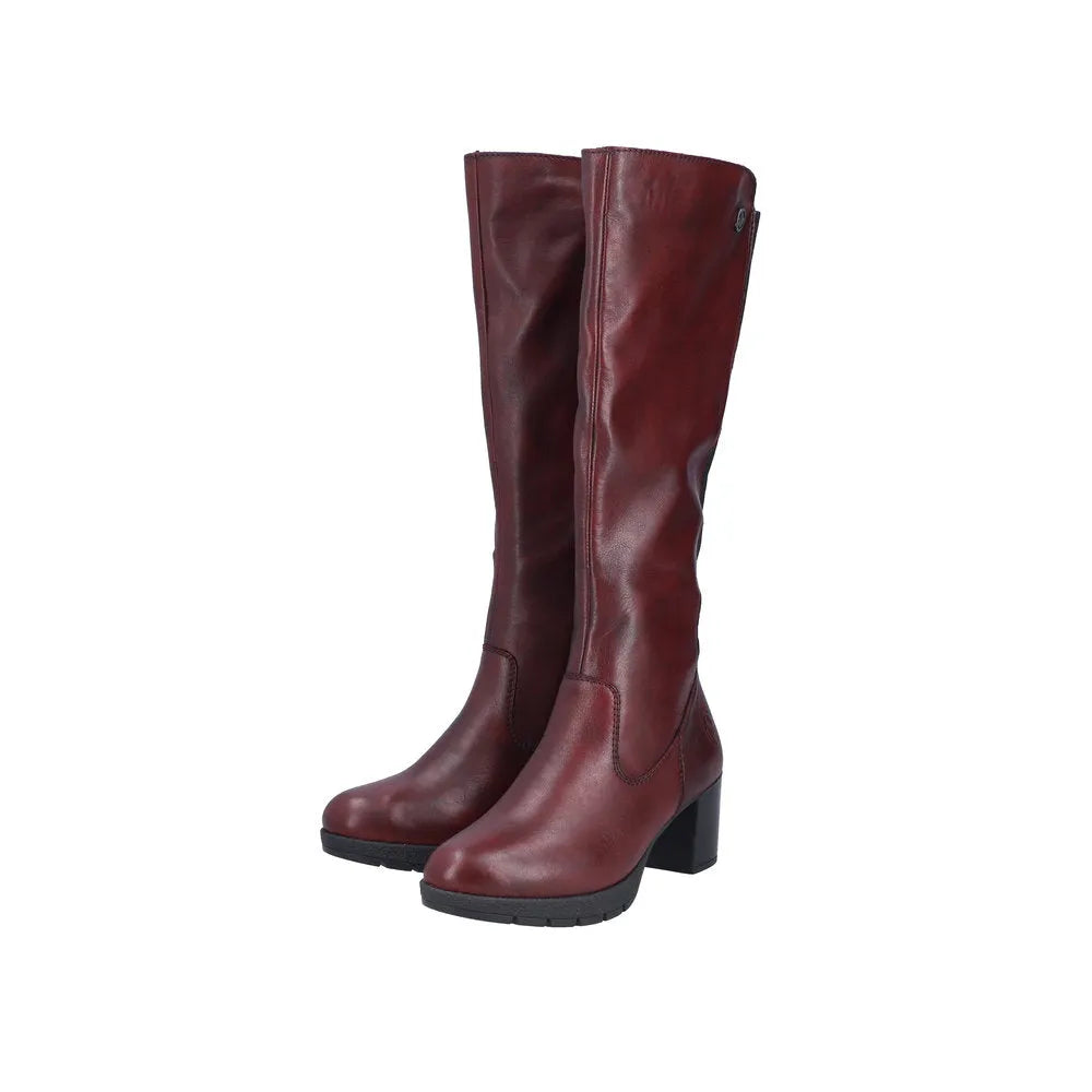 Rieker 77684-35 women's red leather knee-high boots with side zippers and chunky heels.