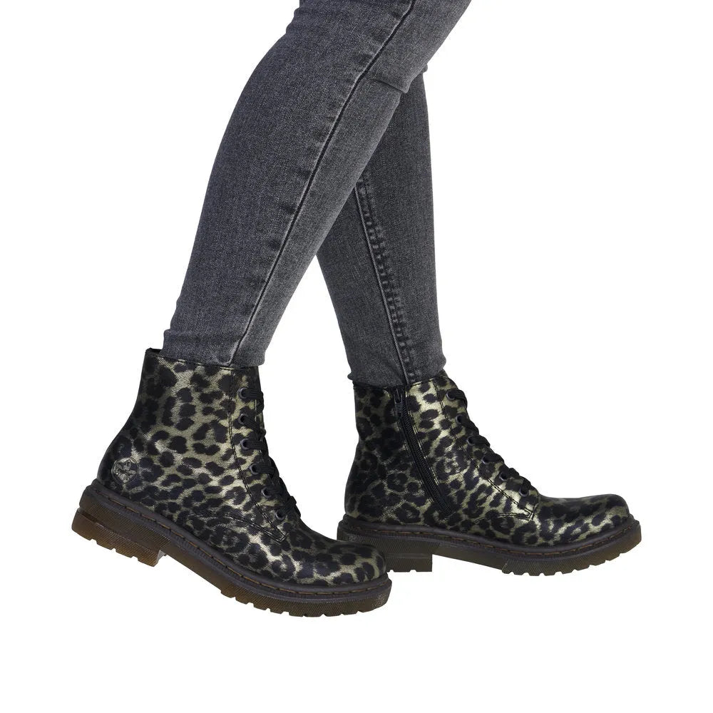 Rieker 78240-90 women's ankle boots with multi-zip and lace design, leopard print, and chunky sole.