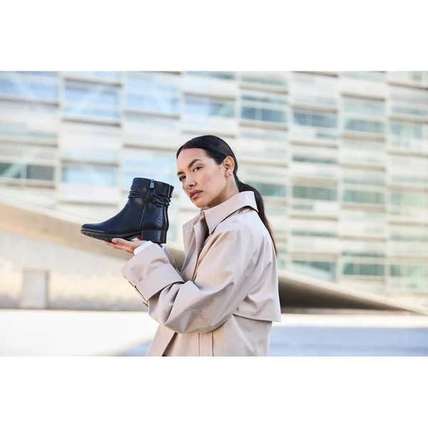 Rieker 78656-00 Ladies Black Leather Twin Zip Ankle Boots, stylish combat design with zip closures and low heel.