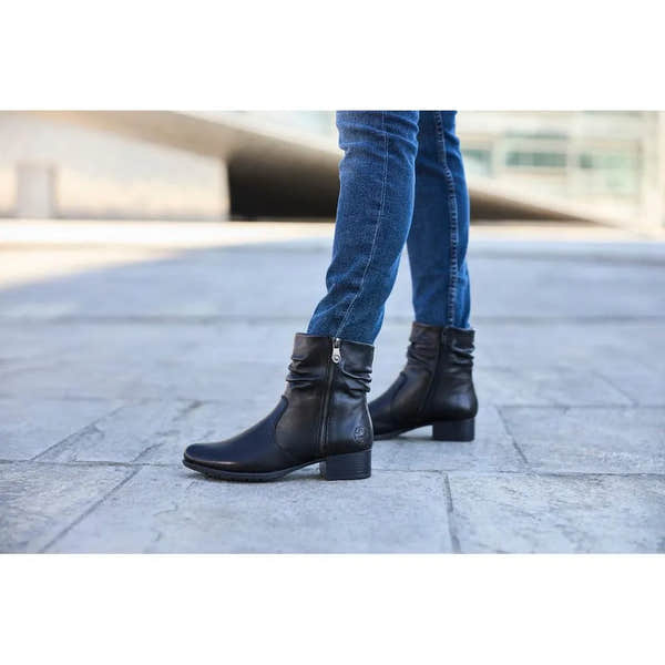 Rieker 78656-00 women's black leather ankle boots with twin zippers and low block heel.