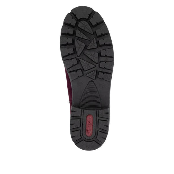 Rieker 79265-30 women's red suede slip-on ankle boots with rugged black rubber outsole and textured tread pattern.