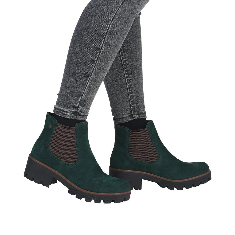 Rieker 79265-55 women's green suede slip-on ankle boots with chunky black soles and elastic side panels.