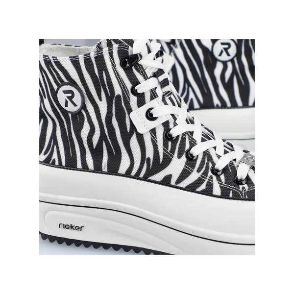 Black and white zebra print vegan ankle boots with laces, zipper, and Rieker logo accents.