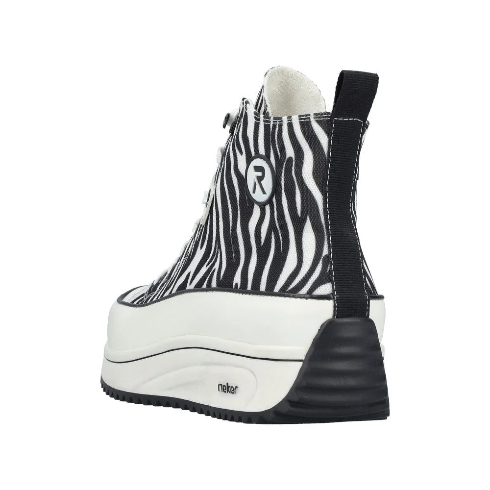 Zebra print vegan ankle boot with lace and zip, chunky white sole, black heel, and pull tab at back.