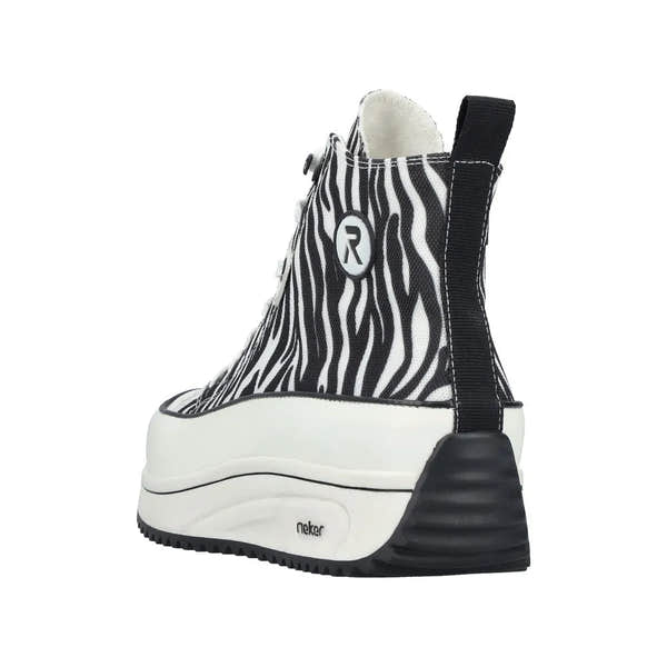 Zebra print vegan ankle boot with lace and zip, chunky white sole, black heel, and pull tab at back.