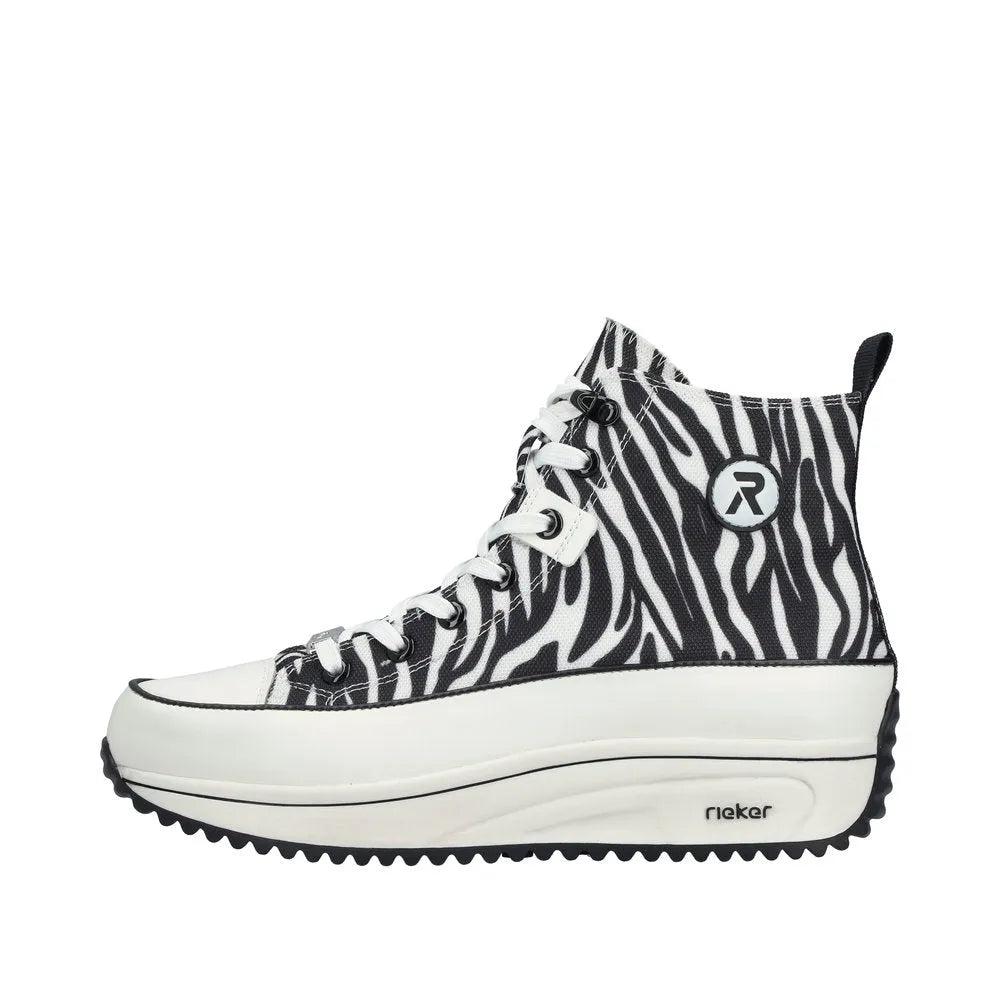 Zebra print vegan ankle boots with zip and lace detail, elevated white sole, and black trim, by Rieker.