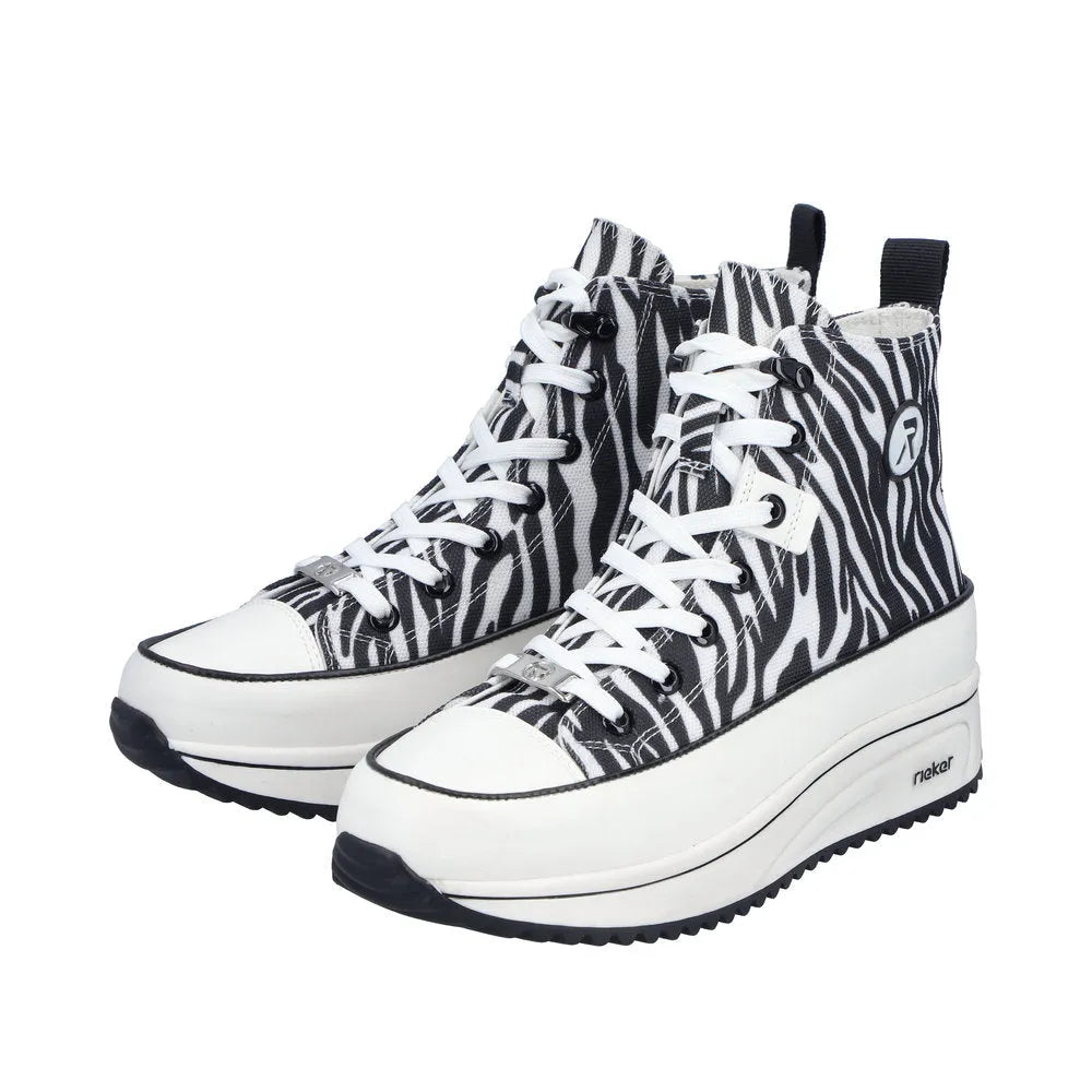 Zebra-print vegan ankle boots with lace-up front, zip closure, chunky platform sole, and black and white color scheme.
