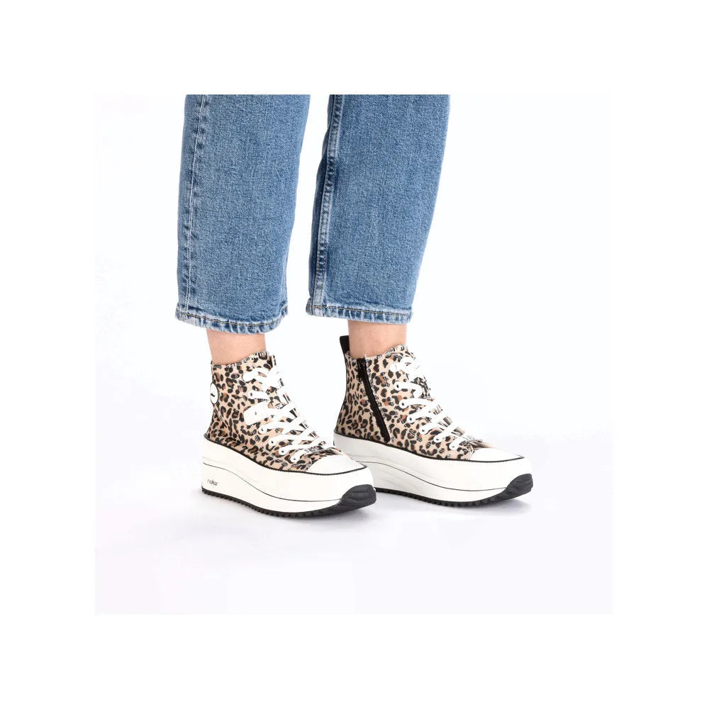 Leopard print textile ankle boots with lace-up front, zipper side, and thick white platform sole.