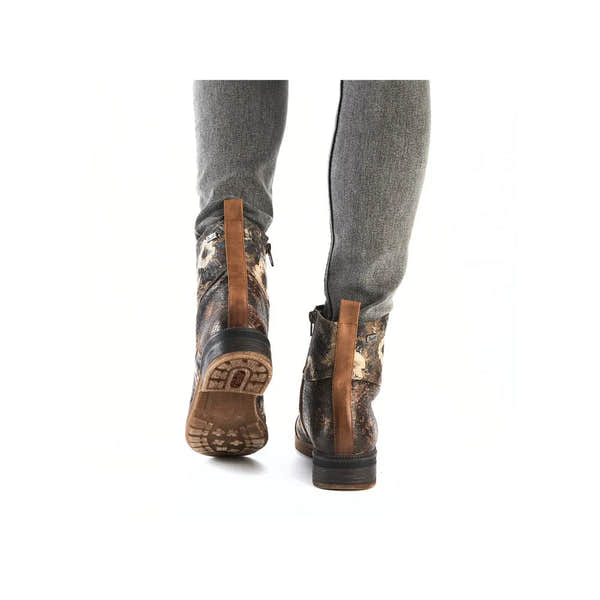 Rieker 94611-90 women's water-resistant ankle boots with zip and lace design, rugged soles, multicolor distressed finish.