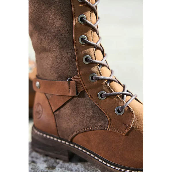 Rieker 94732-25 women's brown knee-high water-resistant boots with lace-up and zip closure.