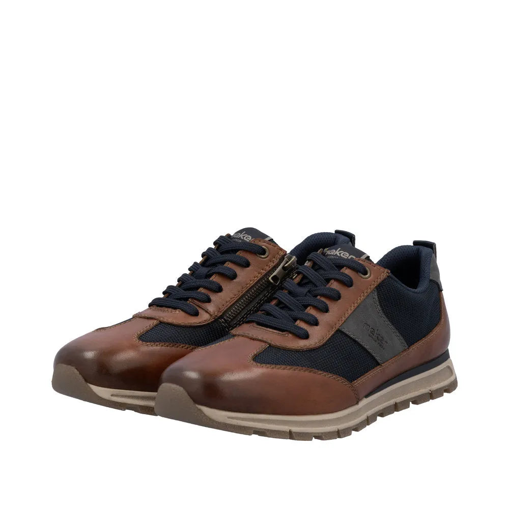 Rieker B0507-24 men's brown leather trainers with zip and lace-up design, navy accents, and durable rubber sole.