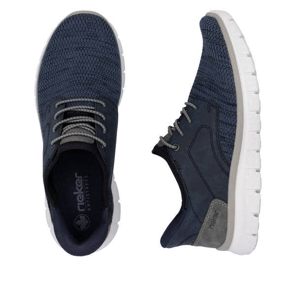 Rieker B6658-14 men's wide-fit navy textile slip-on trainers with cushioned white sole and lace-up design.