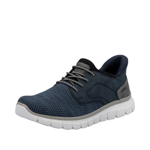 Rieker B6658-14 men's wide-fit navy textile slip-on trainers with cushioned white sole and lace-up closure.