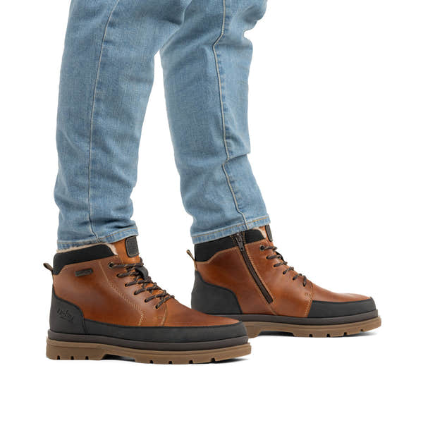 Rieker F7044-25 men's wide brown/black leather water resistant zip & lace ankle boots, on-foot lifestyle view.