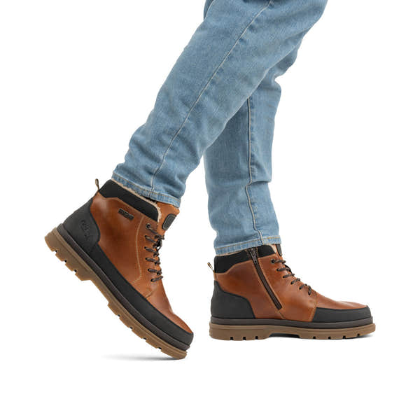 Rieker F7044-25 men's wide brown/black leather water resistant zip & lace ankle boots, lifestyle view 1 of 4.