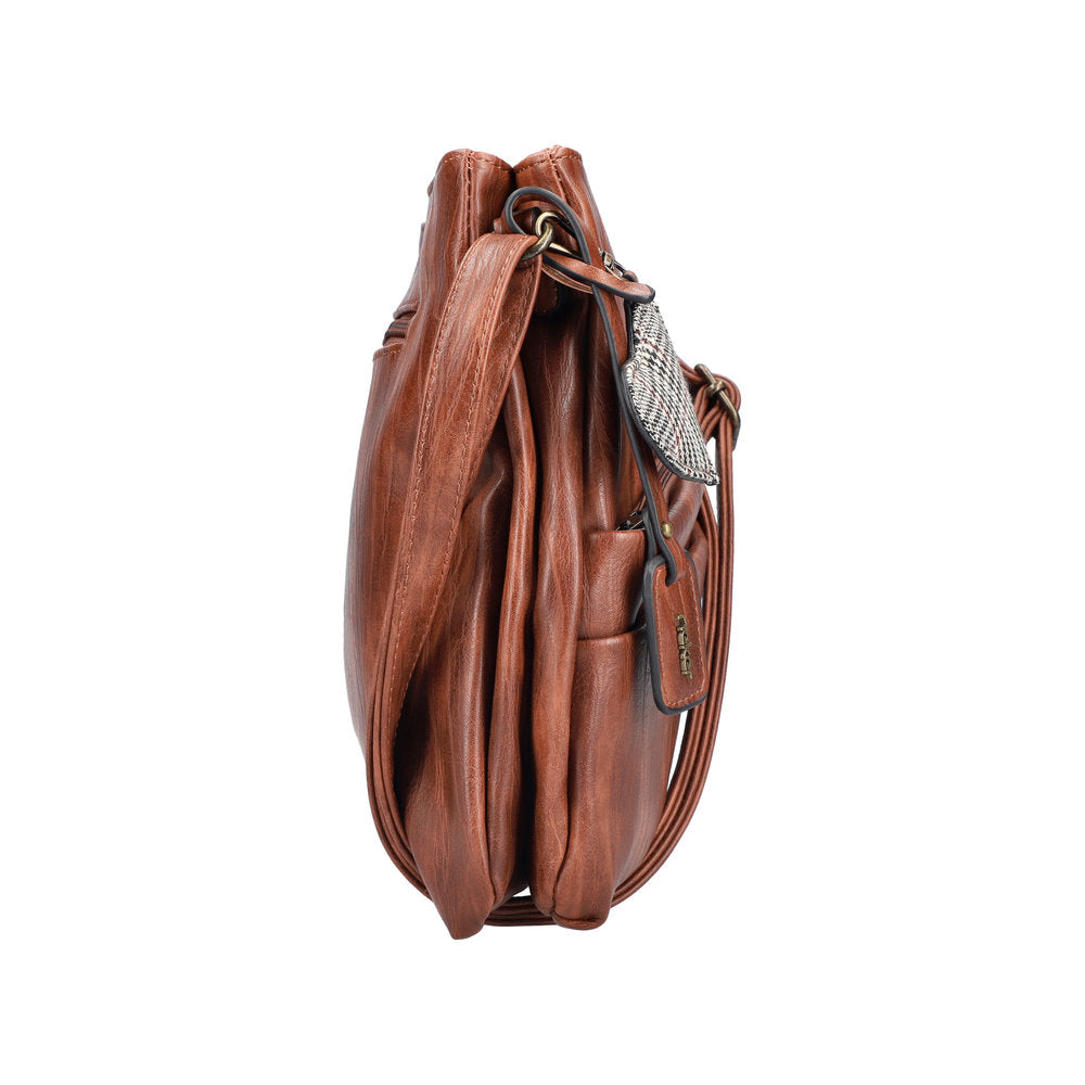 Rieker H1005-22 antique nut brown leather handbag with zip closure and adjustable strap, stylish and spacious accessory.