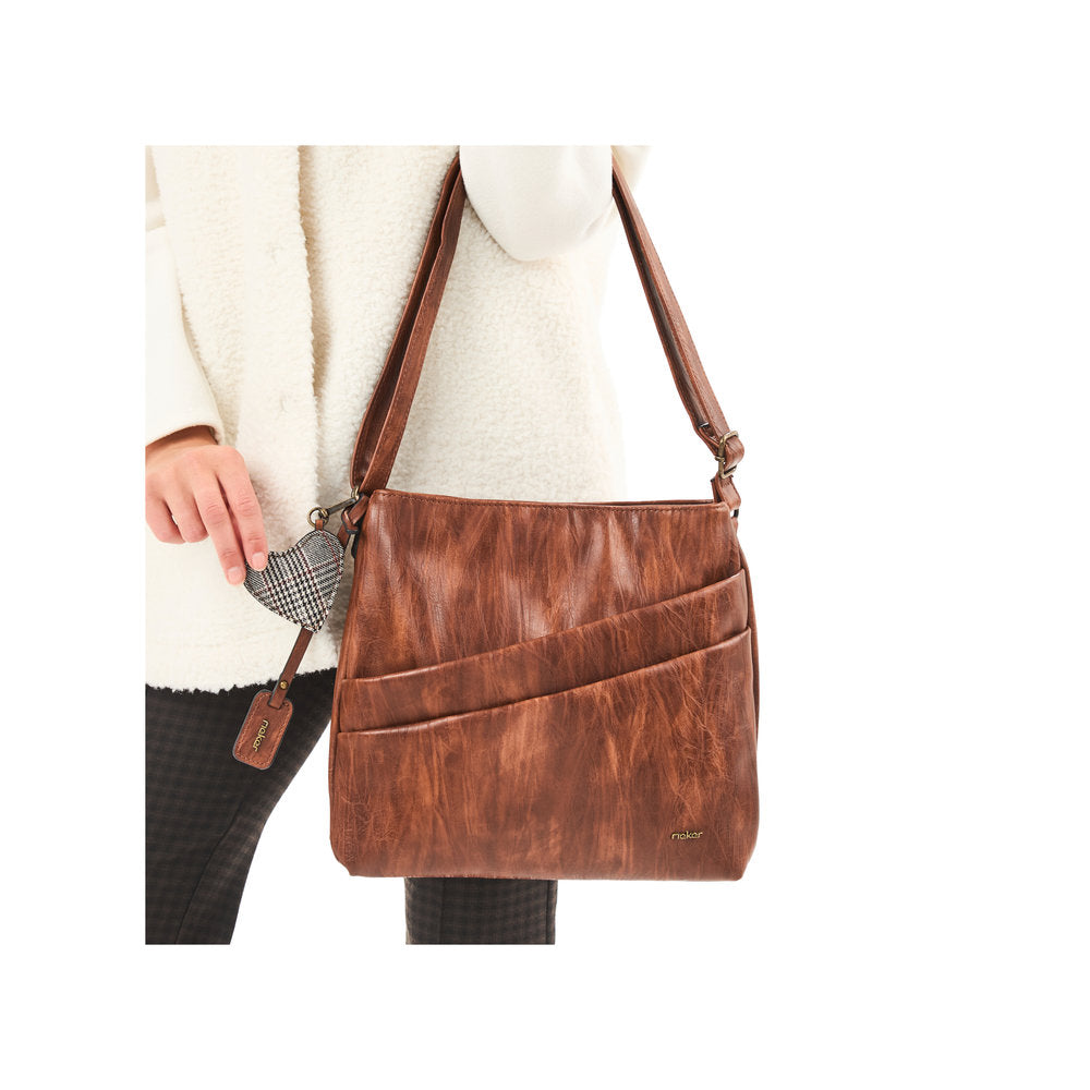 Rieker H1005-22 antique nut brown leather handbag with zip closure, featuring front pockets and adjustable strap.