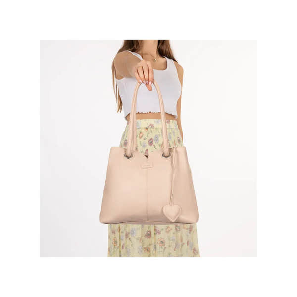 Rieker H1021-31 pink handbag with double handles and heart-shaped keychain, featuring a soft leather texture and spacious design.