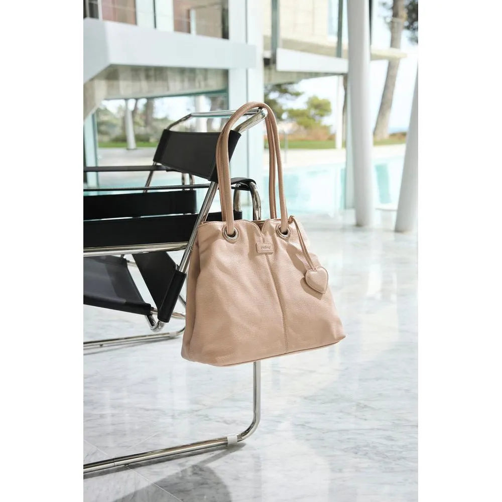 Rieker H1021-31 Pink Handbag with heart-shaped charm, stylish tote design, and dual top handles.