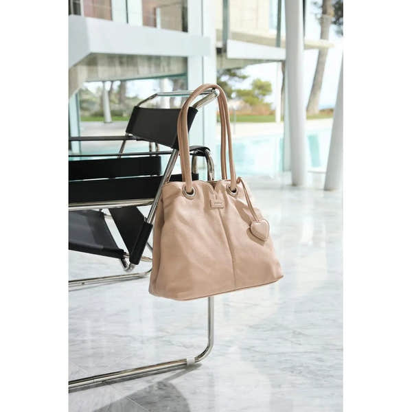 Rieker H1021-31 Pink Handbag with heart-shaped charm, stylish tote design, and dual top handles.