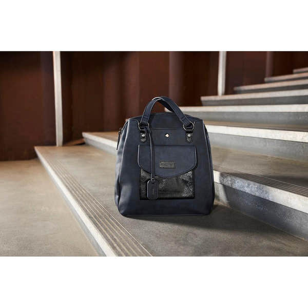 Rieker H1036-14 Ocean Navy & Black backpack, stylish everyday bag with front pocket and top handles, on a stairway.