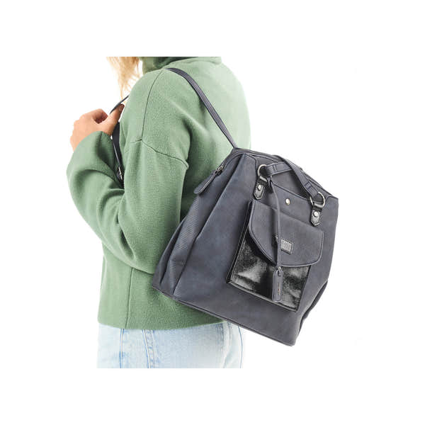 Rieker H1036-14 Ocean Navy & Black backpack with multiple compartments, front pocket, and adjustable strap on a woman in a green sweater.