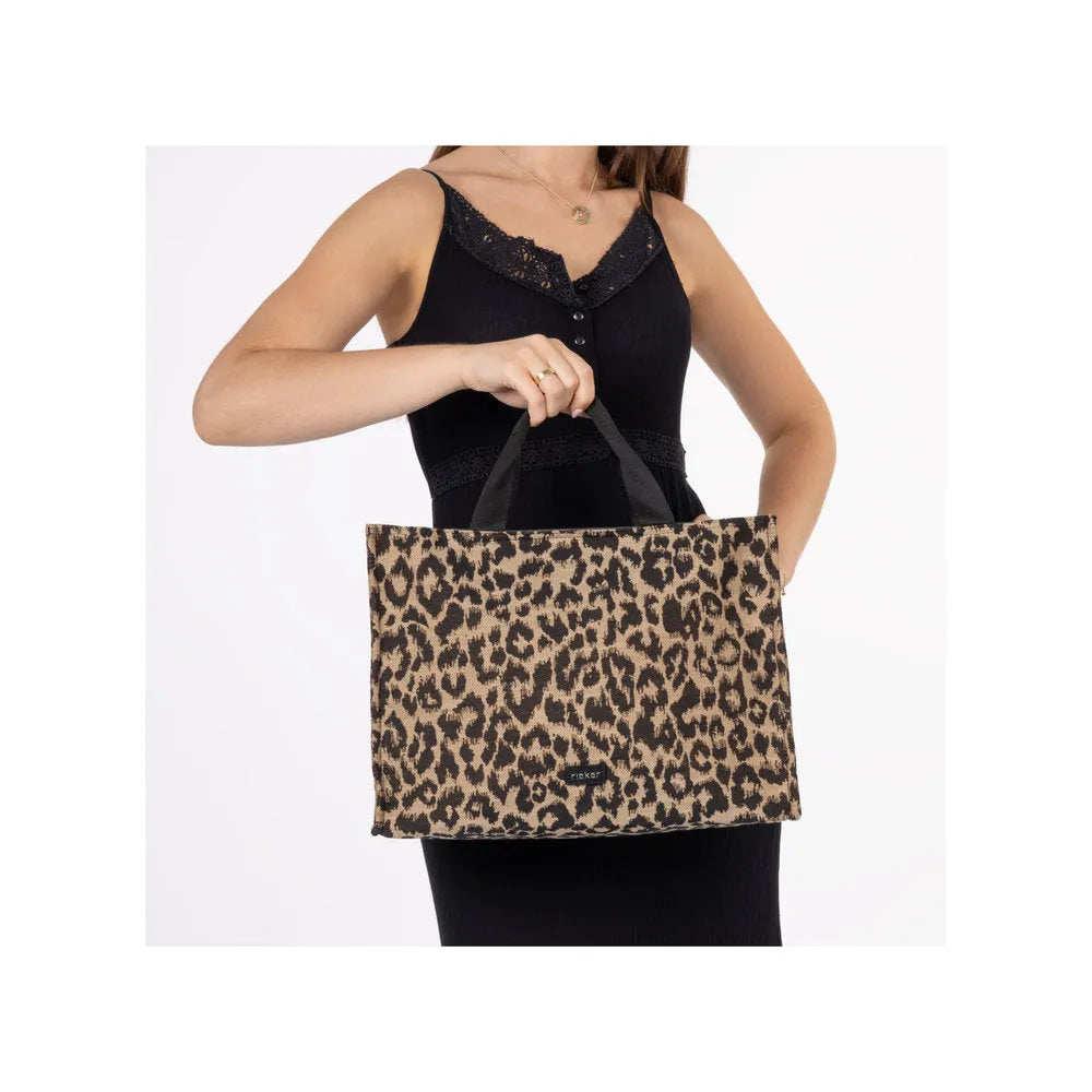 Rieker H1070-90 leopard print tote handbag with black handles, stylish animal pattern, spacious design, perfect for everyday use.