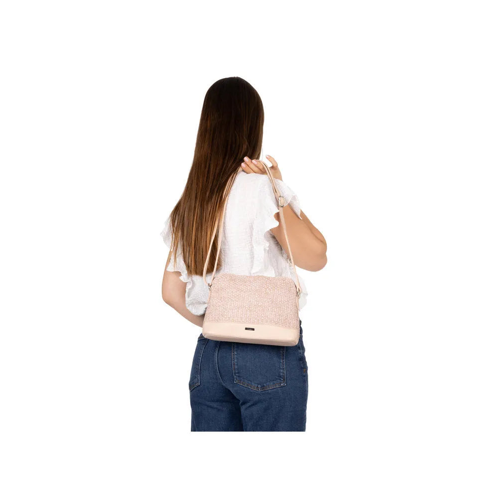 Rieker H1510-93 Pink Multi Ladies Handbag with textured design, shoulder strap, and beige accents, shown on a woman.