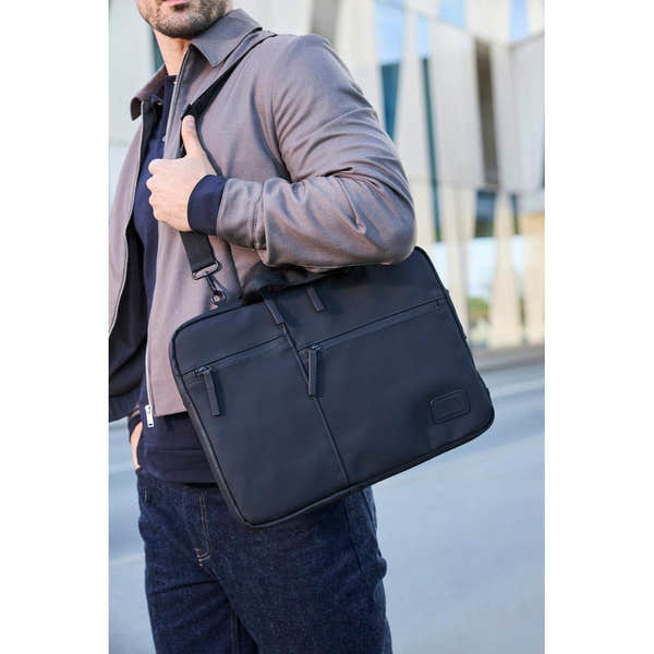 Rieker H5000-00 black business bag with multiple compartments, worn by man in urban setting, sleek and professional design.