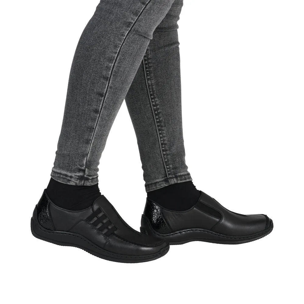 Rieker L1777-00 women's black leather slip-on shoes, comfortable casual footwear with stylish design and slip-resistant sole.