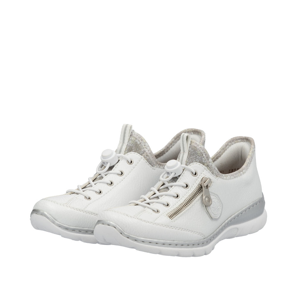 White women's elasticated casual shoes with zipper detail, cushioned sole, and comfortable design by Rieker.