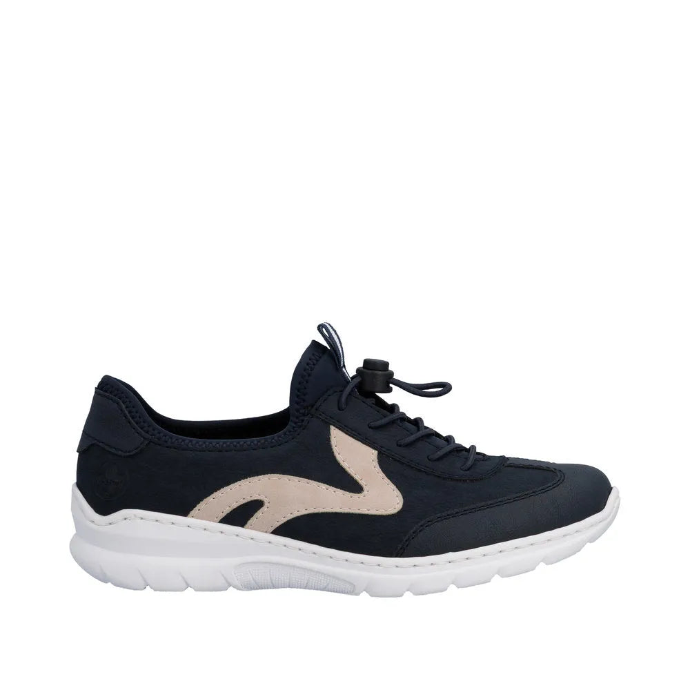 Rieker Ladies sneaker with navy elasticated fastener, beige logo detail, cushioned white sole, and breathable fabric upper.
