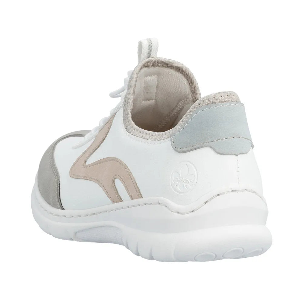Rieker ladies' casual sneaker with elasticated fastener, white with beige and gray accents, cushioned sole, and mixed material upper.