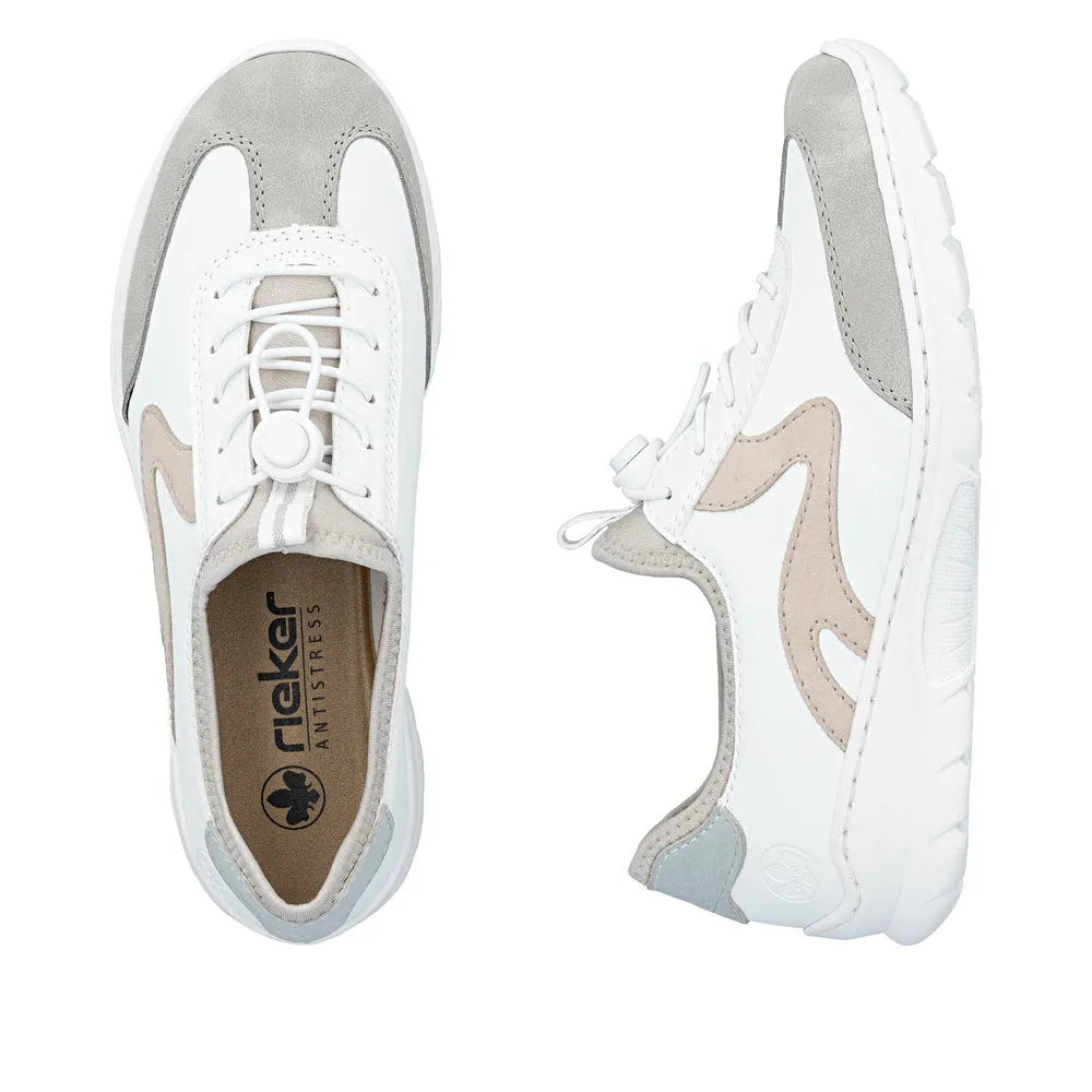 White and beige slip-on sneakers with elasticated fasteners, mesh overlays, and a cushioned sole for women.